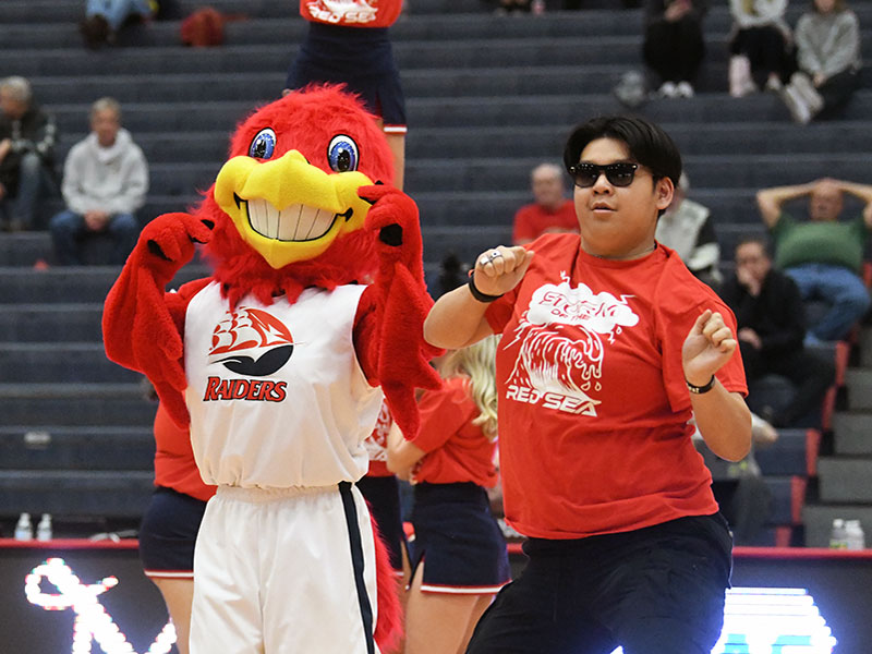 Big red and student dancing