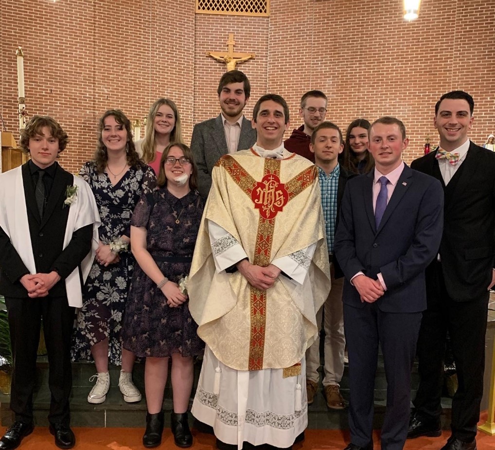 catholic ministries students and priest group photo