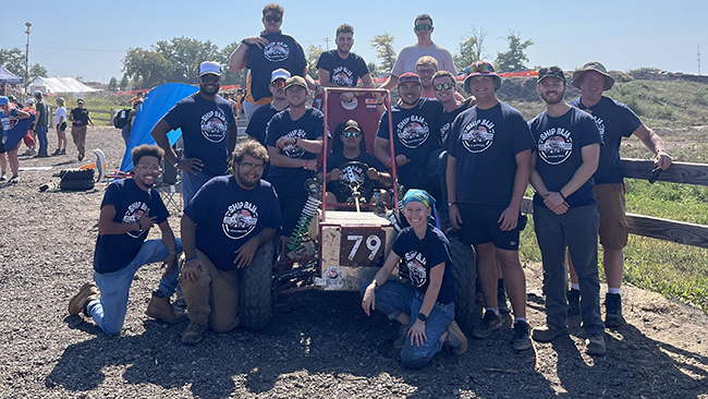 Baja students with their dune buggy